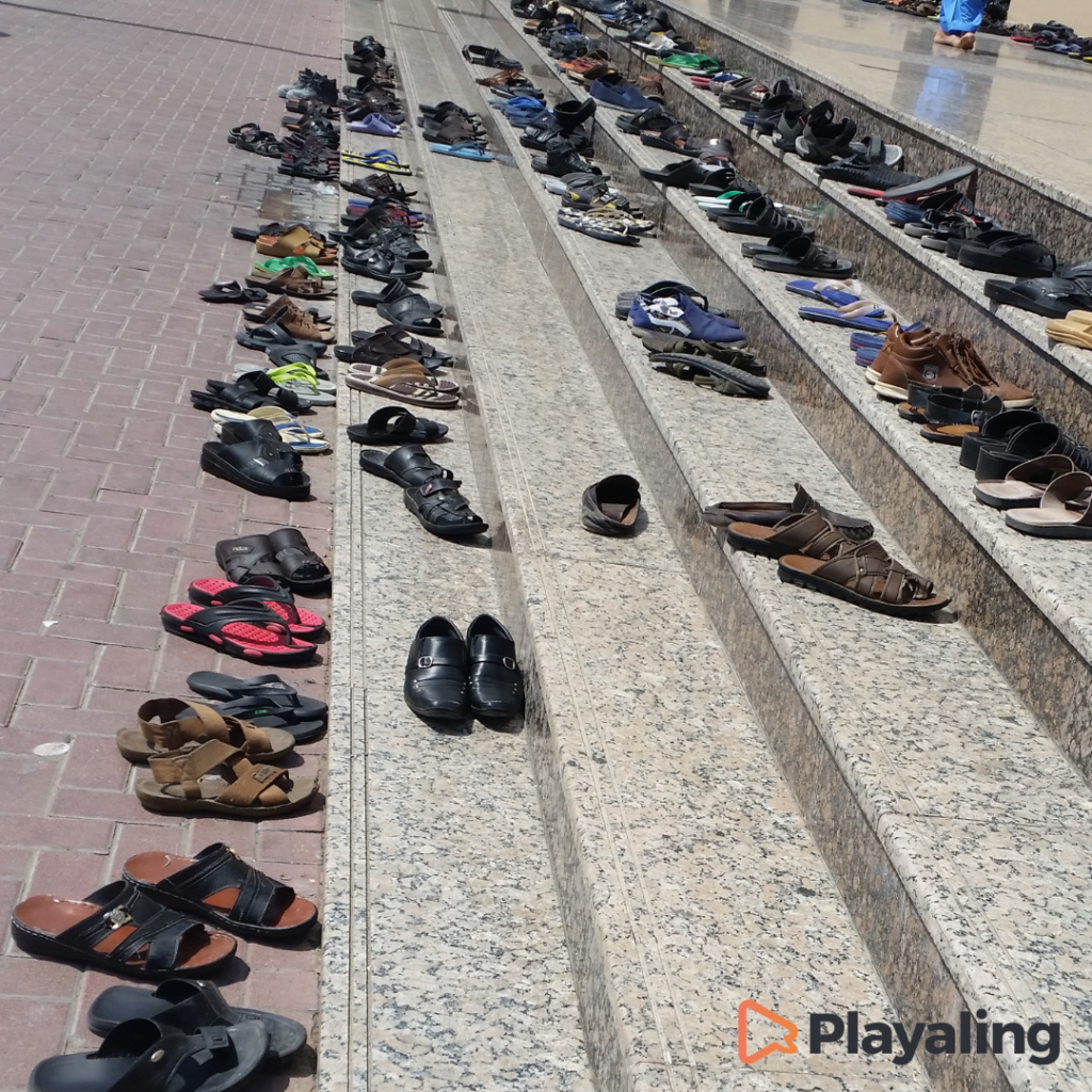 Shoes on sthe stairs in front of the Mosque